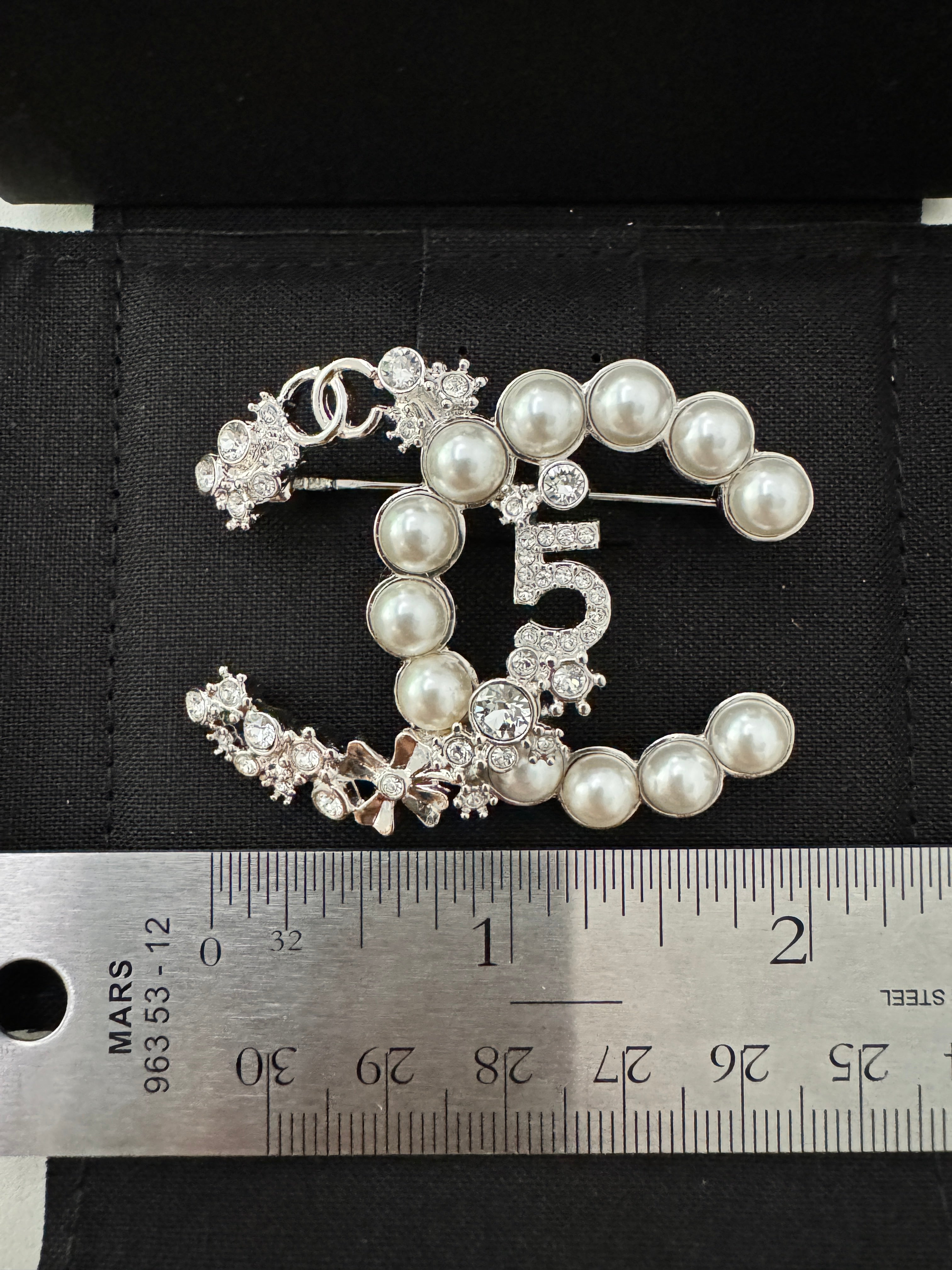 Silver CC pearl outlet brooch